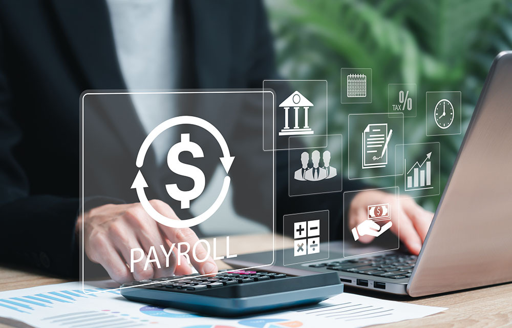 An assortment of icons related to payroll and business management with a businesswoman using a calculator and laptop behind them.