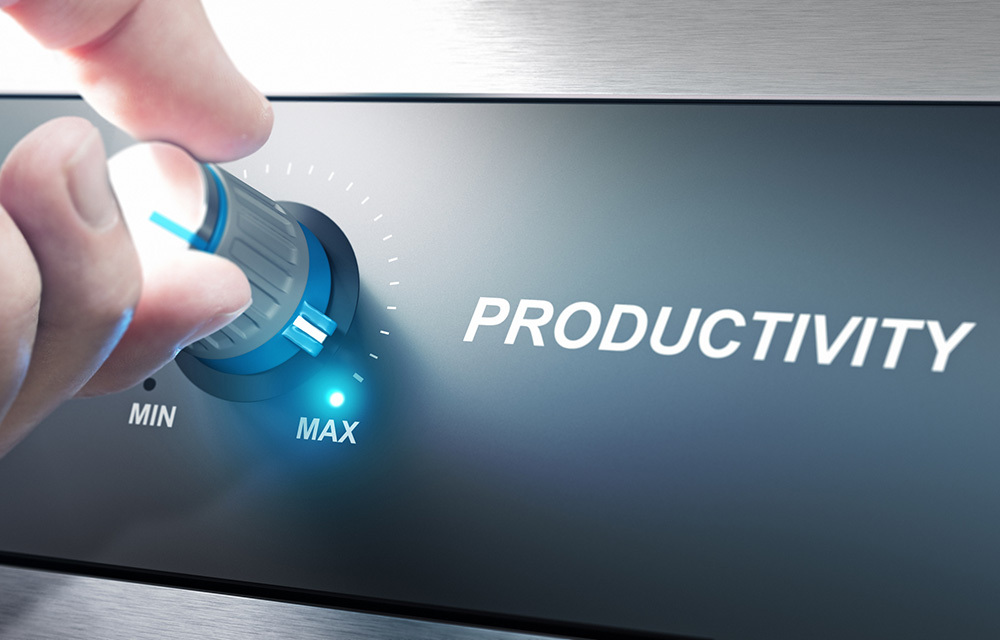 Hand turning a productivity knob to the max setting.