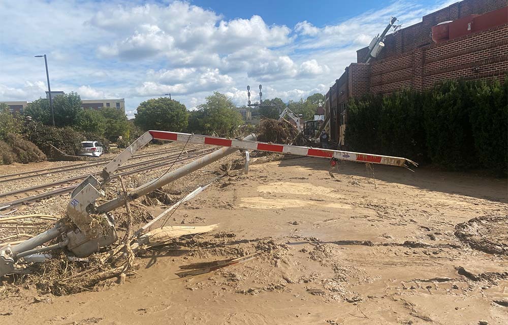 Destroyed railroad crossing, roads, and cars near Biltmore Village in Asheville, North Carolina.