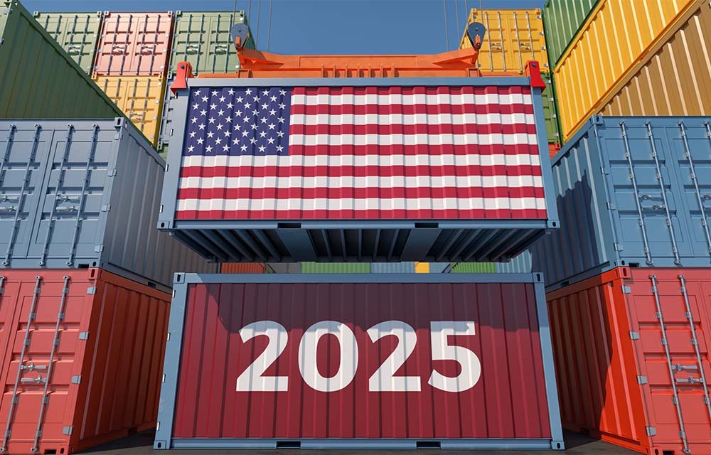 Freight containers being stacked on top of each other with an American flag on the top container and "2025" on the bottom.