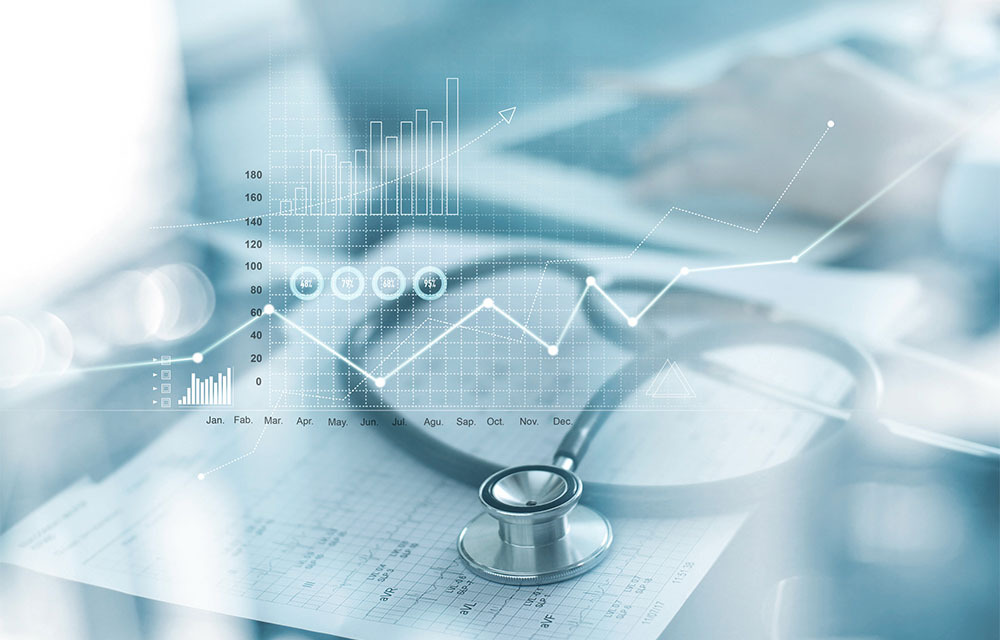 Image of a stethoscope laying on a cardiogram with a semi-transparent overlay of various types of graphs.