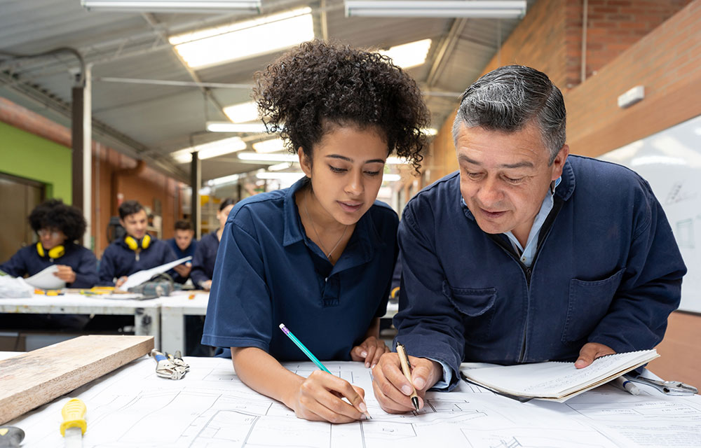 Man showing a girl how to solve the problem