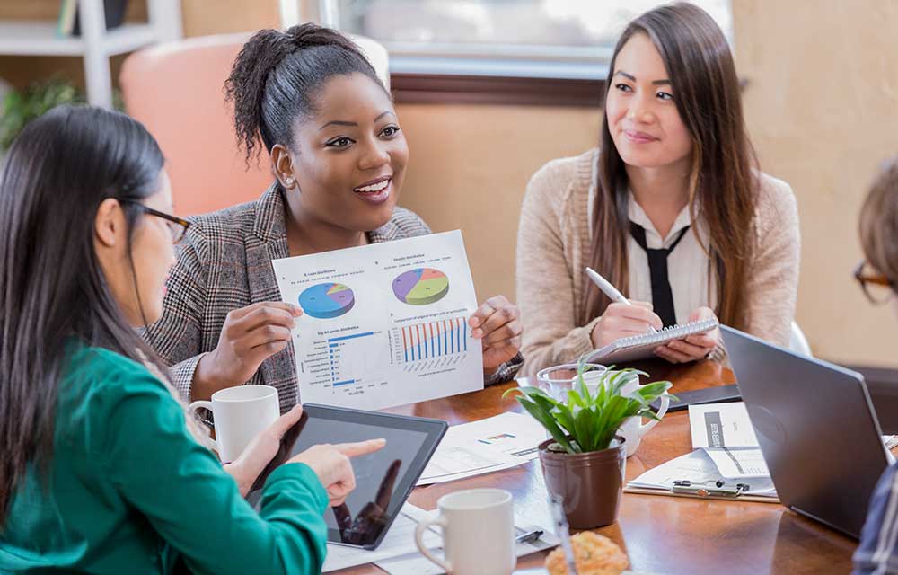 Business people discussing reports