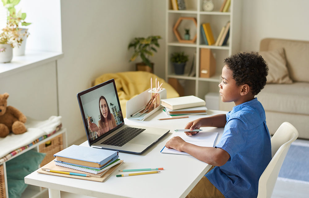 young student learning from a remote tutor