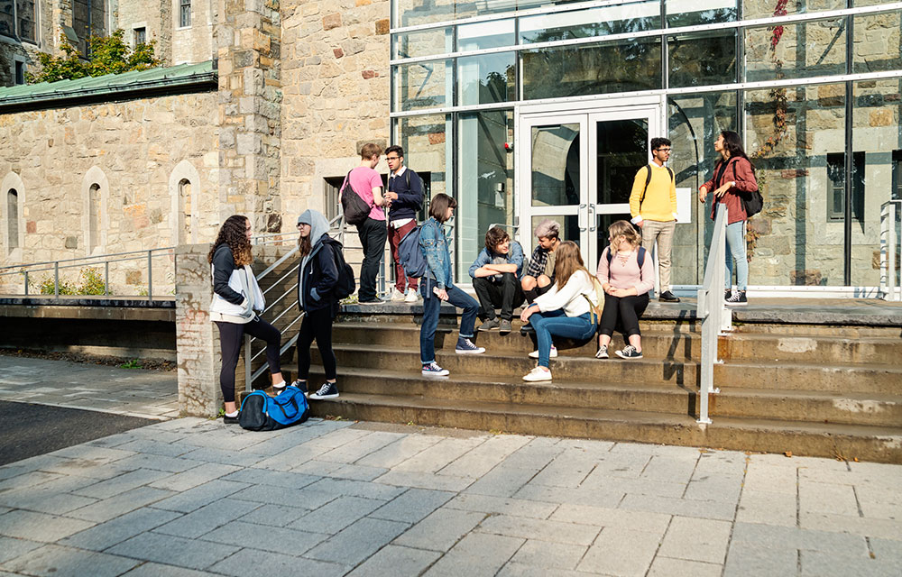 students sitting on stairs