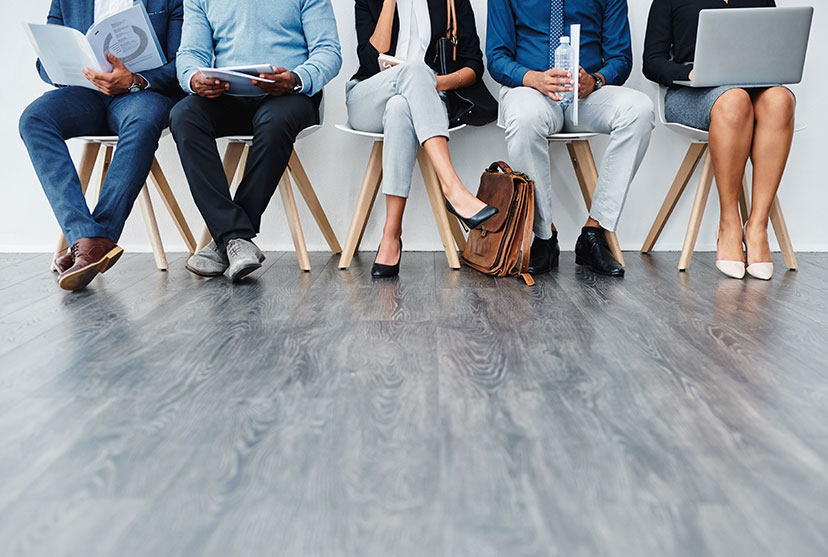 photo of people waiting in chairs