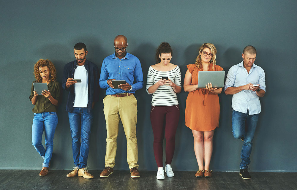 photo of people holding mobile devices