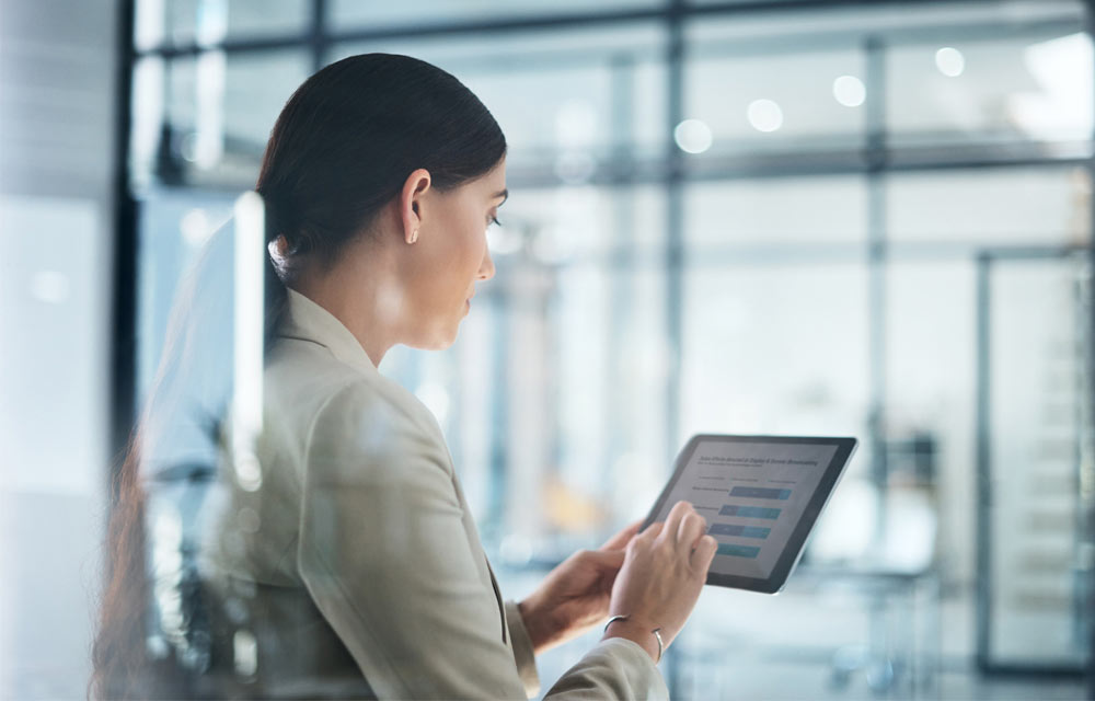 Woman in an office using a tablet