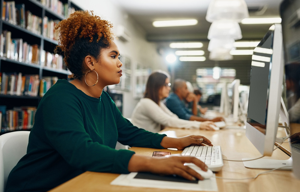 photo of a woman using a computer