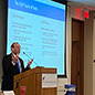 Peter Dolkart address an audience in Baltimore