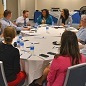 People talking at a round table