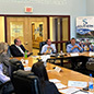 Tom Barkin sits at table with other leaders discussing Community Conversations in West Virginia