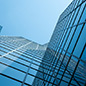 Angle view upward of modern building with a clear blue sky in the background