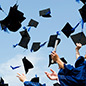 graduation caps tossed in the air