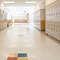 Lockers in an empty high school hallway