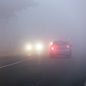 cars driving in heavy fog