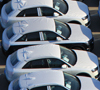 Row of cars in parking lot